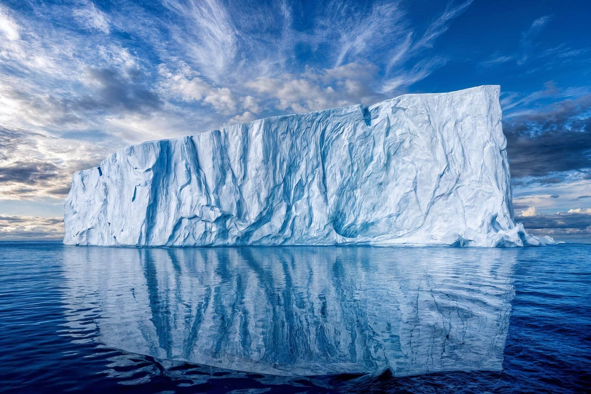 Iceberg under a blue sky